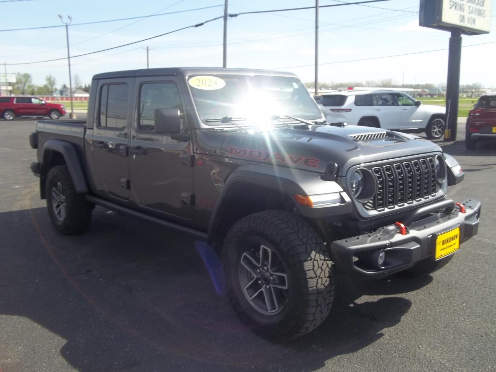 2024 Jeep Gladiator Mojave in Granite Crystal Metallic Clearcoat — front three-quarter view