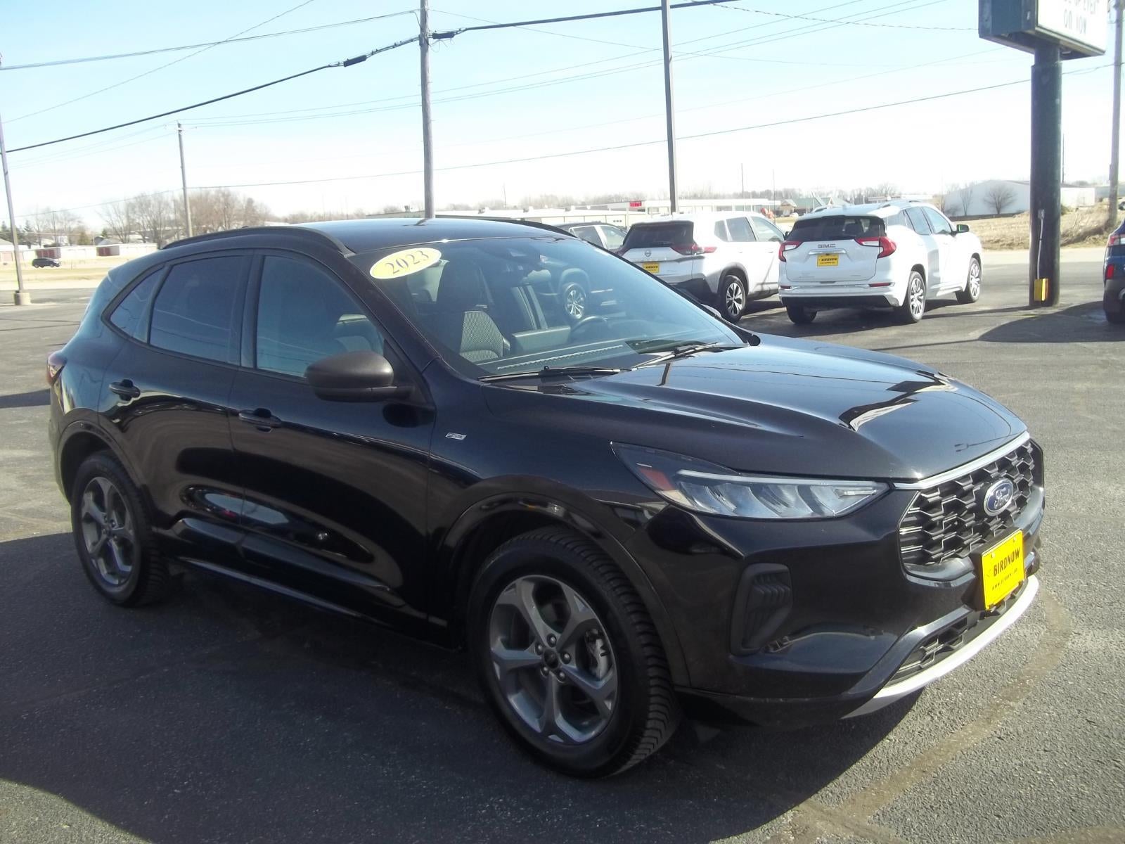 2023 Ford Escape ST-Line in Agate Black Metallic — front three-quarter view