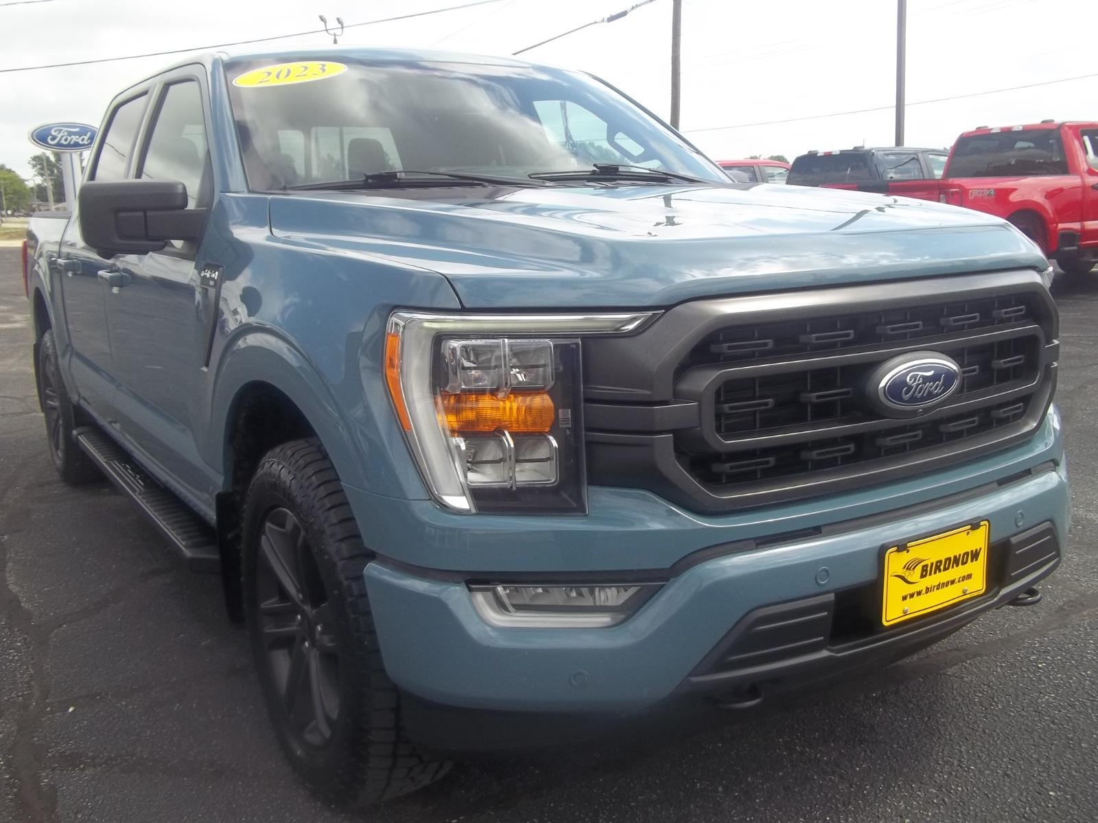 2023 Ford F-150 XLT in Area 51 Blue — front three-quarter view